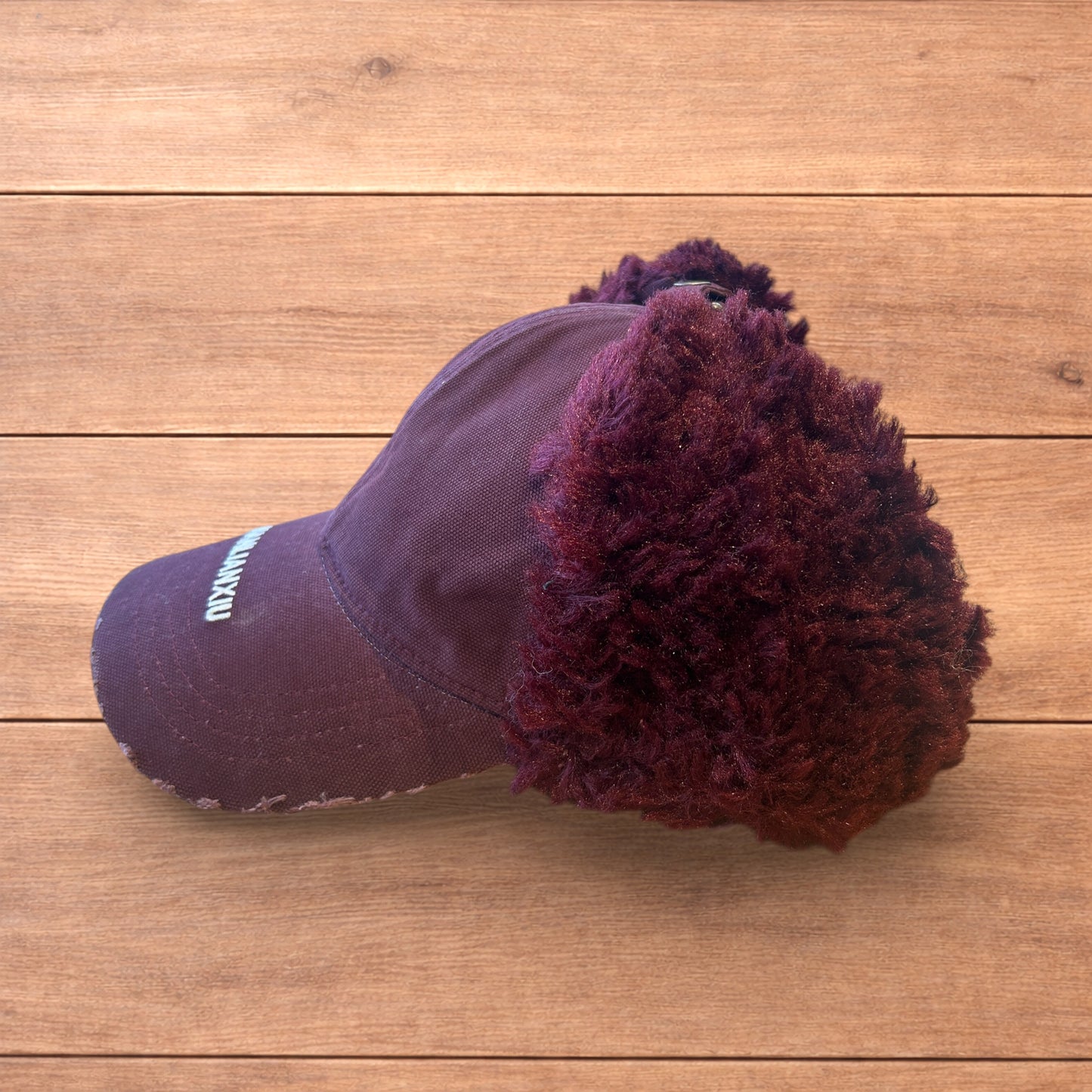 Vintage style trapper Russian ear flap hat cap in maroon/red colour way.