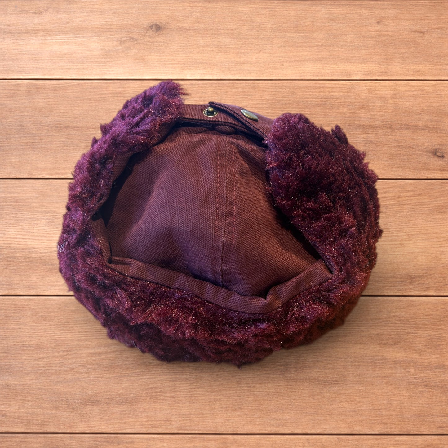 Vintage style trapper Russian ear flap hat cap in maroon/red colour way.
