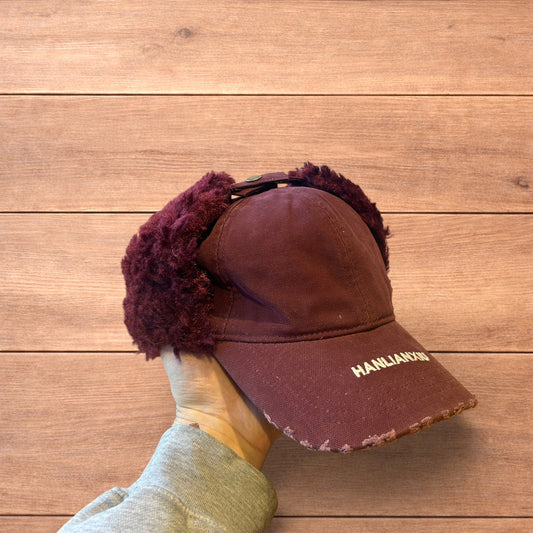 Vintage style trapper Russian ear flap hat cap in maroon/red colour way.