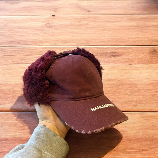 Vintage style trapper Russian ear flap hat cap in maroon/red colour way.
