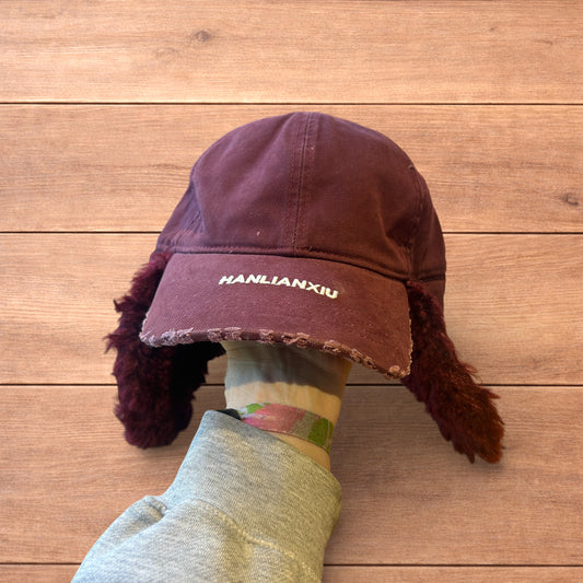 Vintage style trapper Russian ear flap hat cap in maroon/red colour way.
