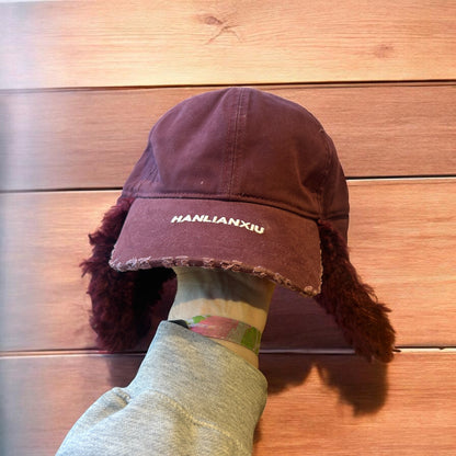 Vintage style trapper Russian ear flap hat cap in maroon/red colour way.