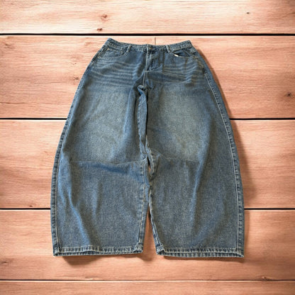 Vintage skater style baggy wide leg fit jeans with fade in mid blue.