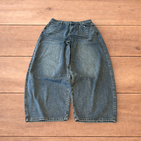 Vintage skater style baggy wide leg fit jeans with fade in mid blue.