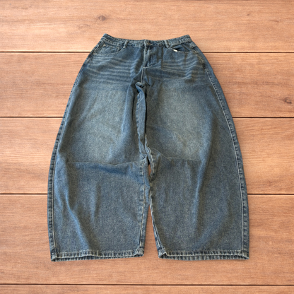 Vintage skater style baggy wide leg fit jeans with fade in mid blue.