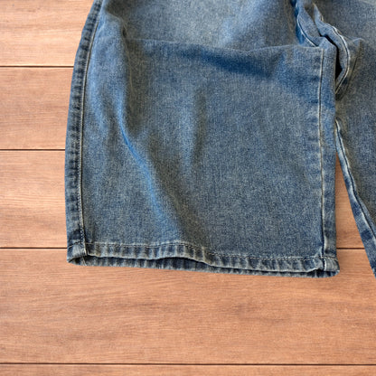 Vintage skater style baggy wide leg fit jeans with fade in mid blue.