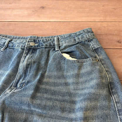 Vintage skater style baggy wide leg fit jeans with fade in mid blue.