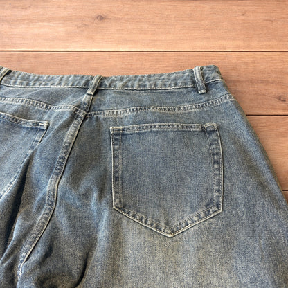 Vintage skater style baggy wide leg fit jeans with fade in mid blue.
