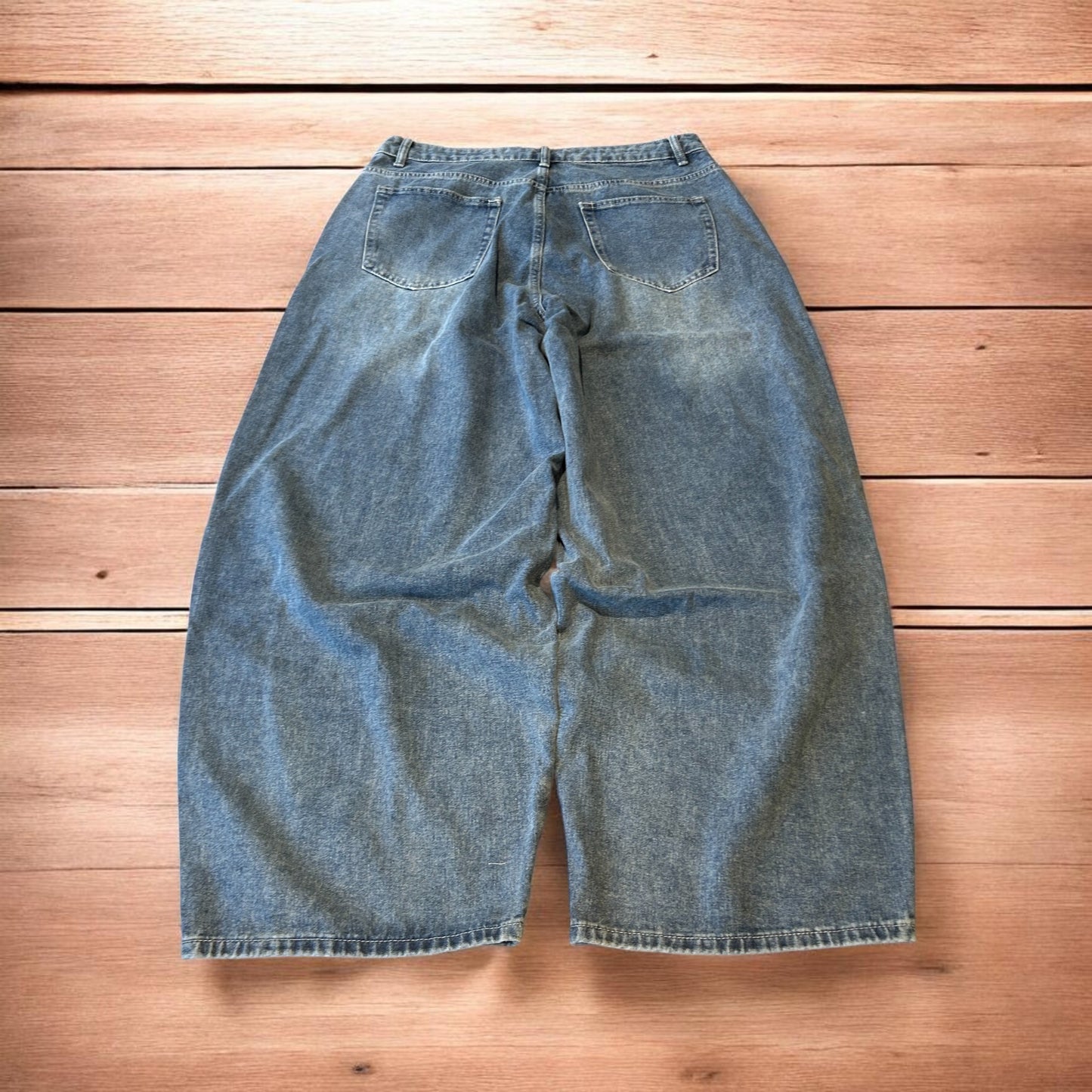 Vintage skater style baggy wide leg fit jeans with fade in mid blue.