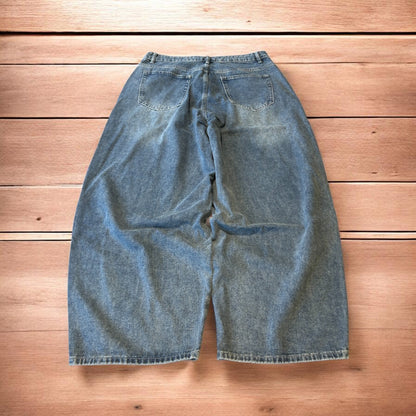 Vintage skater style baggy wide leg fit jeans with fade in mid blue.