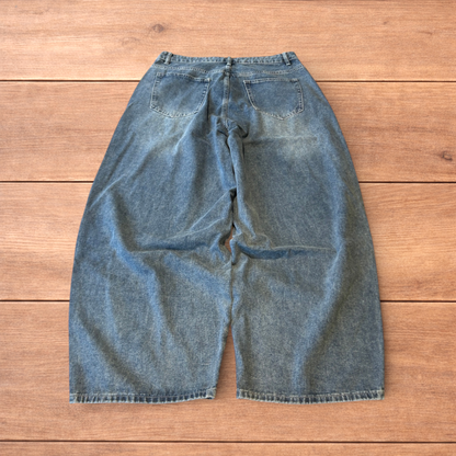 Vintage skater style baggy wide leg fit jeans with fade in mid blue.