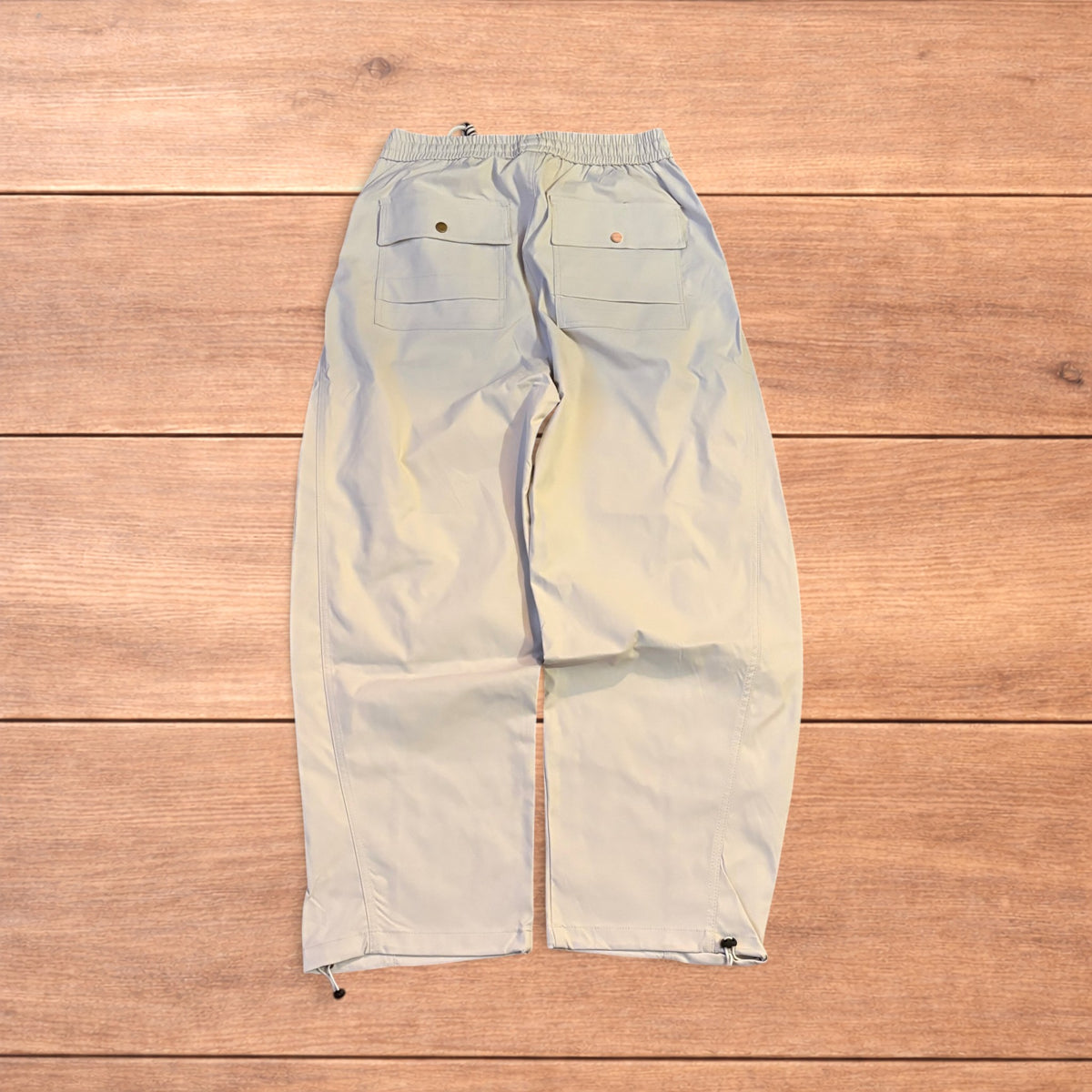 Baggy gorpcore tech hiking pants in beige.