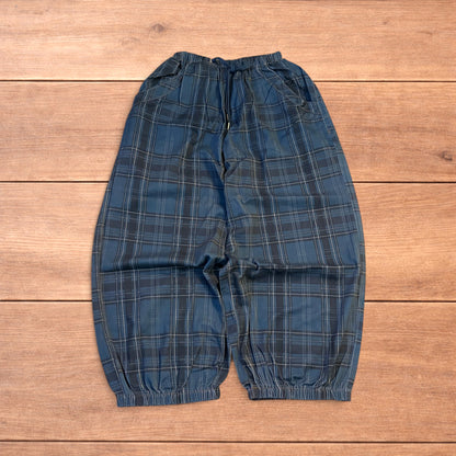 Baggy wide leg checkered parachute joggers trousers in navy blue.