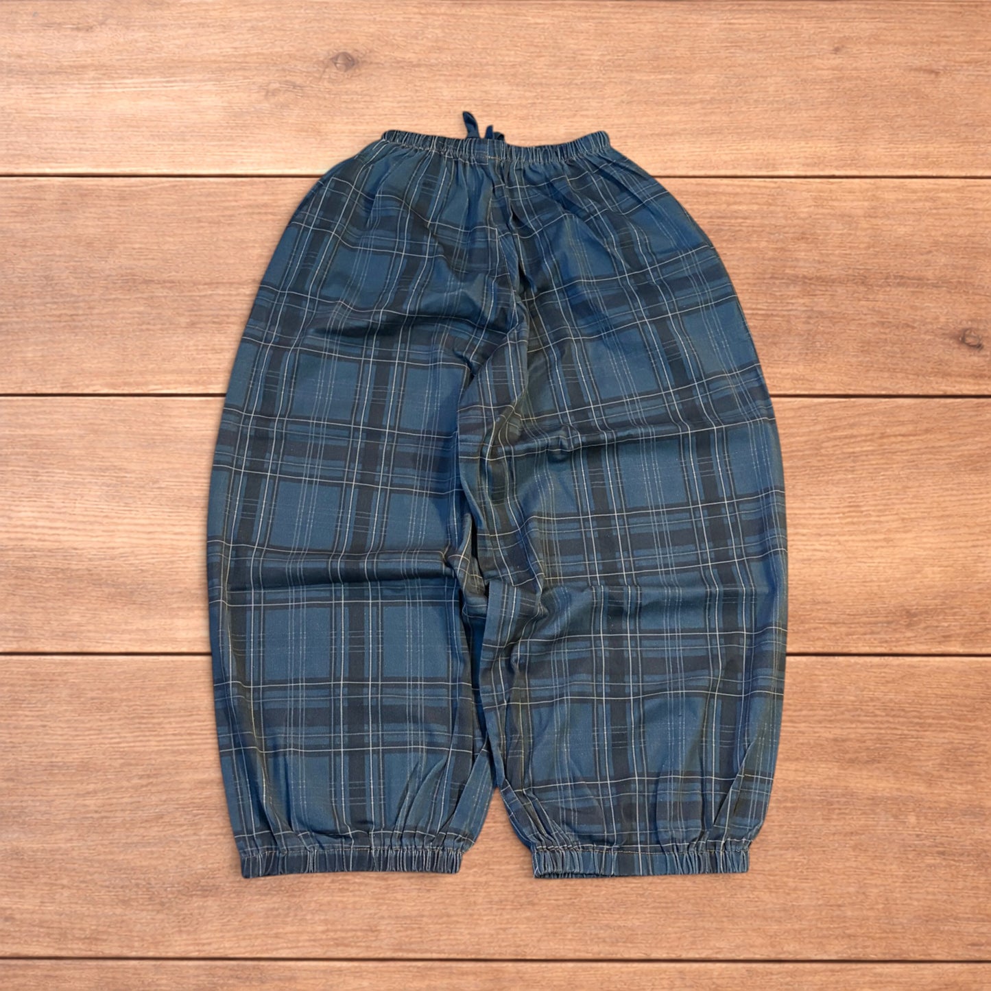 Baggy wide leg checkered parachute joggers trousers in navy blue.