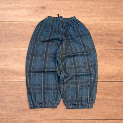 Baggy wide leg checkered parachute joggers trousers in navy blue.