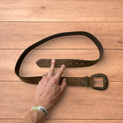 Vintage style faux leather western cowboy gothic belt in brown with brass trim.