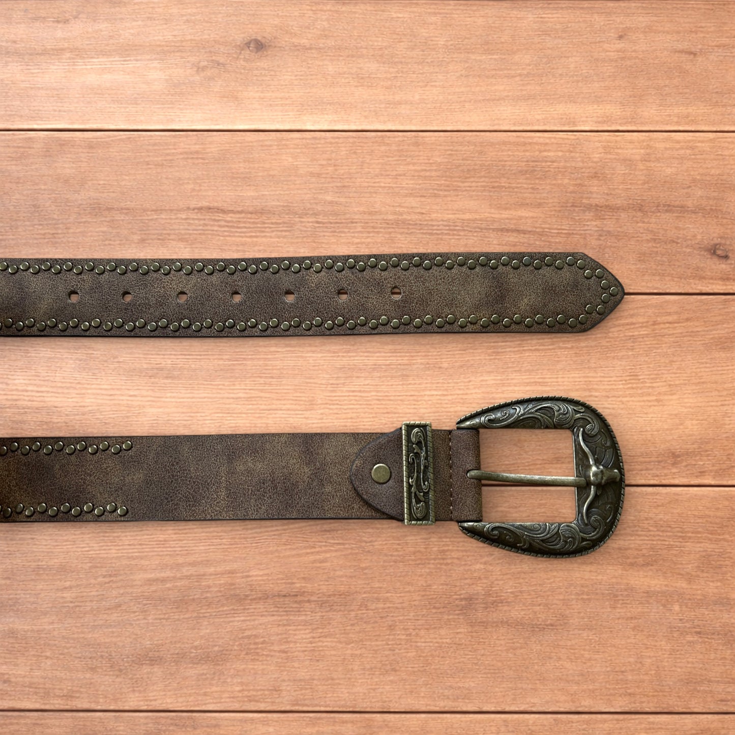 Vintage style faux leather western cowboy gothic belt in brown with brass trim.
