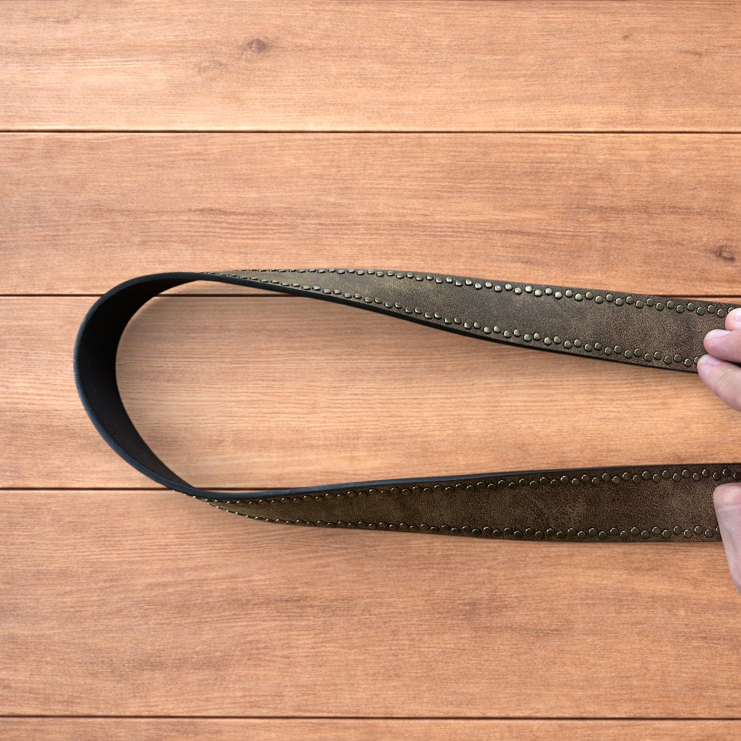 Vintage style faux leather western cowboy gothic belt in brown with brass trim.