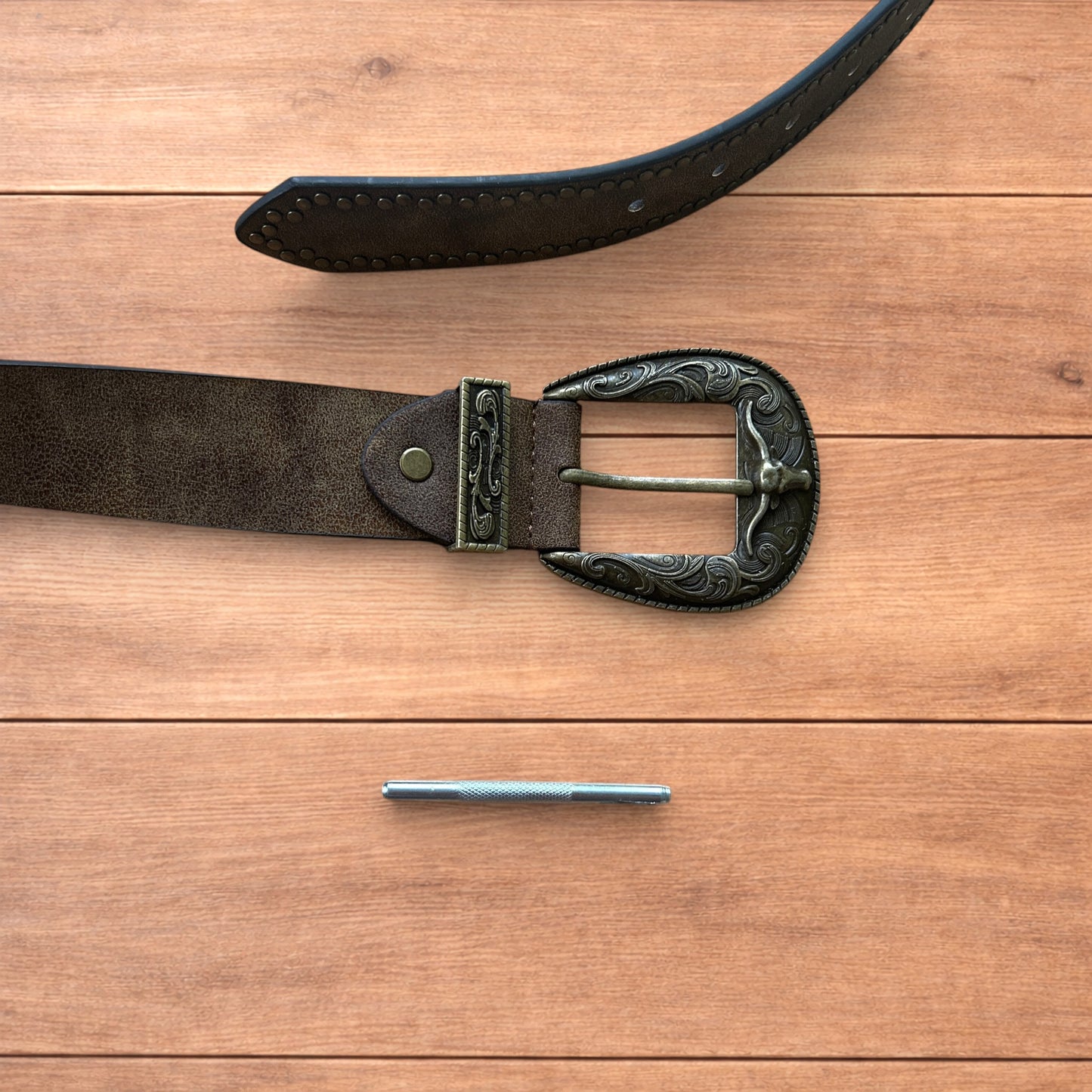 Vintage style faux leather western cowboy gothic belt in brown with brass trim.