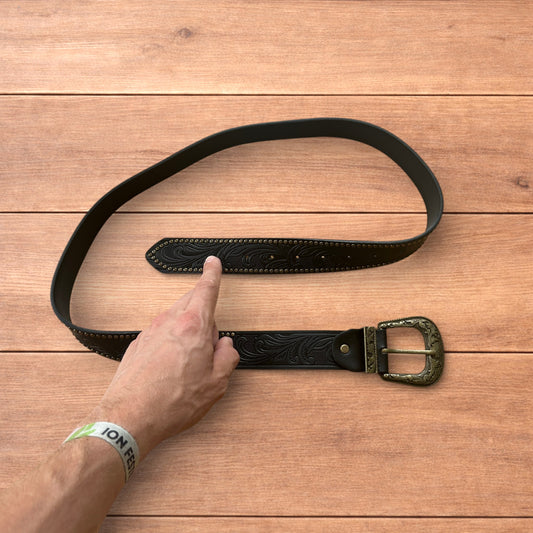 Vintage style faux leather western cowboy gothic belt in black with brass trim.