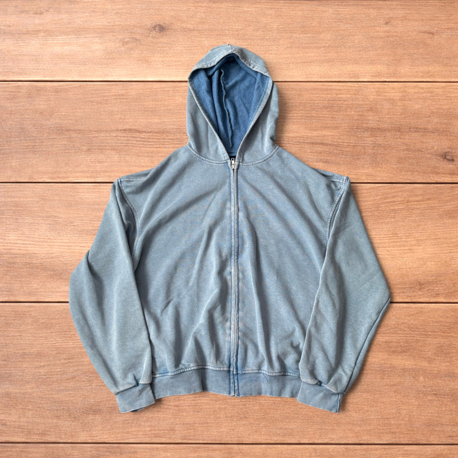 Light blue vintage style baggy zip up hoodie jumper laid flat showing front, back and details.