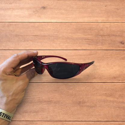 Cool wrap around sunglasses in pink/purple frame with black lense.