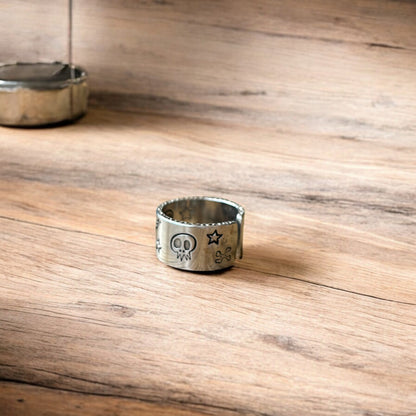 Lovely vintage style stainless steel gothic skater skull ring in silver with gold accent. One size.