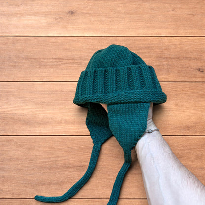 Vintage style dappy ear flap bobble hat in dark green.