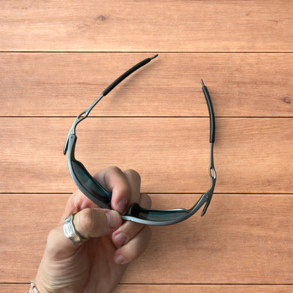 Insane metal frame sunglasses in black with red lense.