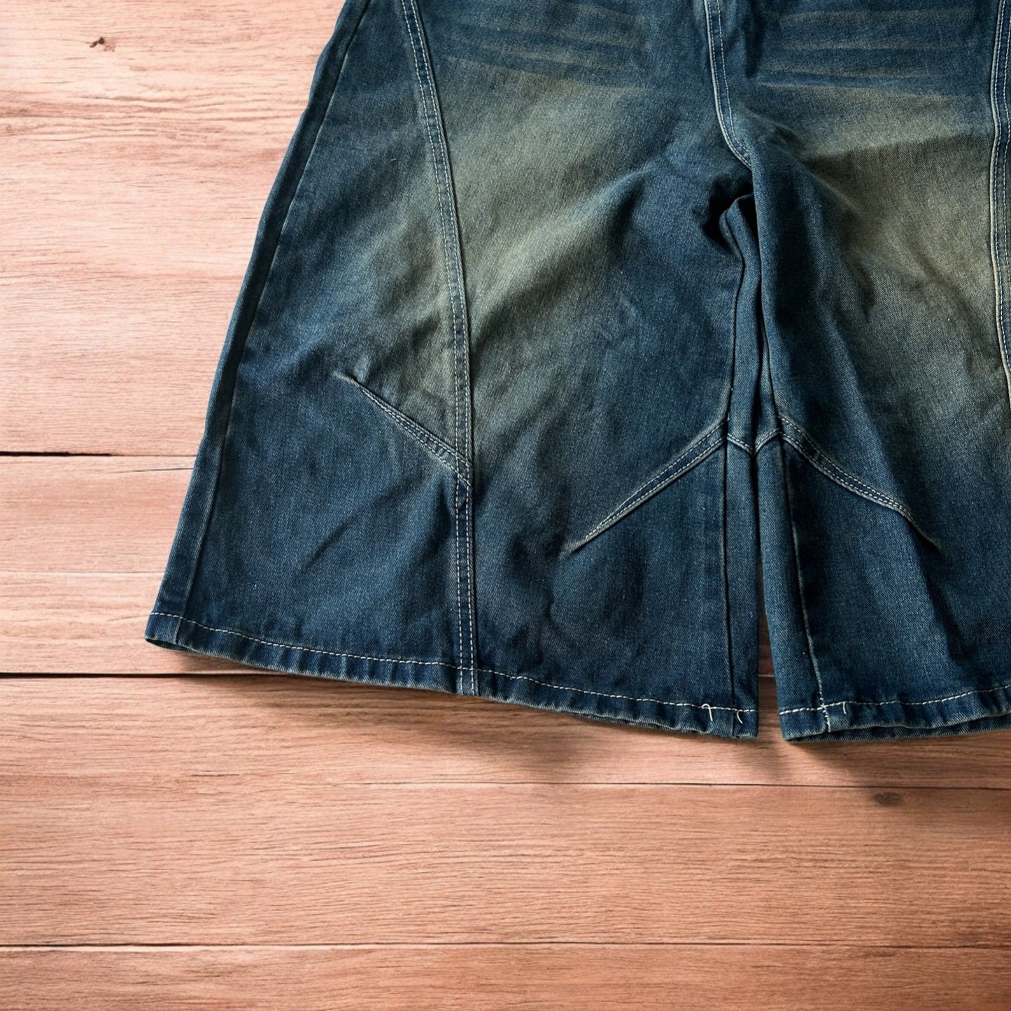 Super baggy wide leg denim carpenter shorts jorts in dark blue wash.