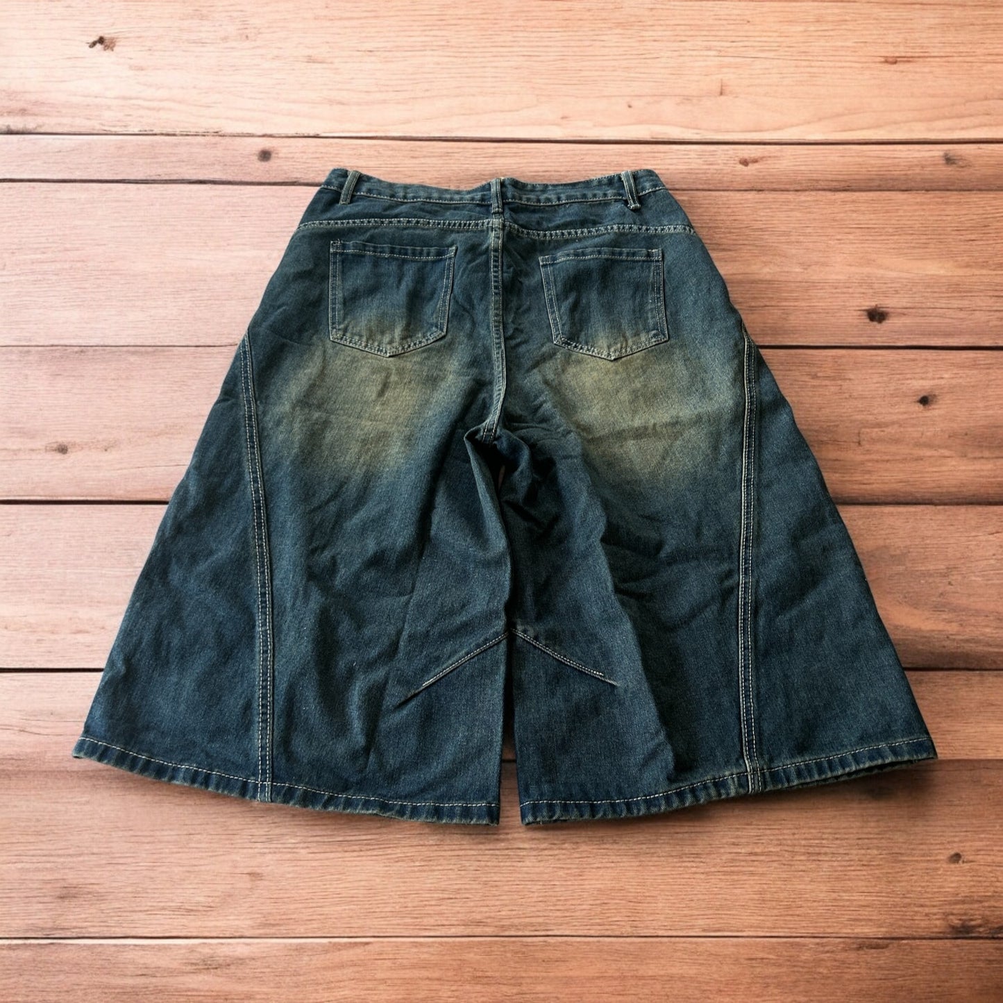 Super baggy wide leg denim carpenter shorts jorts in dark blue wash.