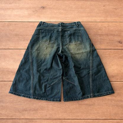 Super baggy wide leg denim carpenter shorts jorts in dark blue wash.