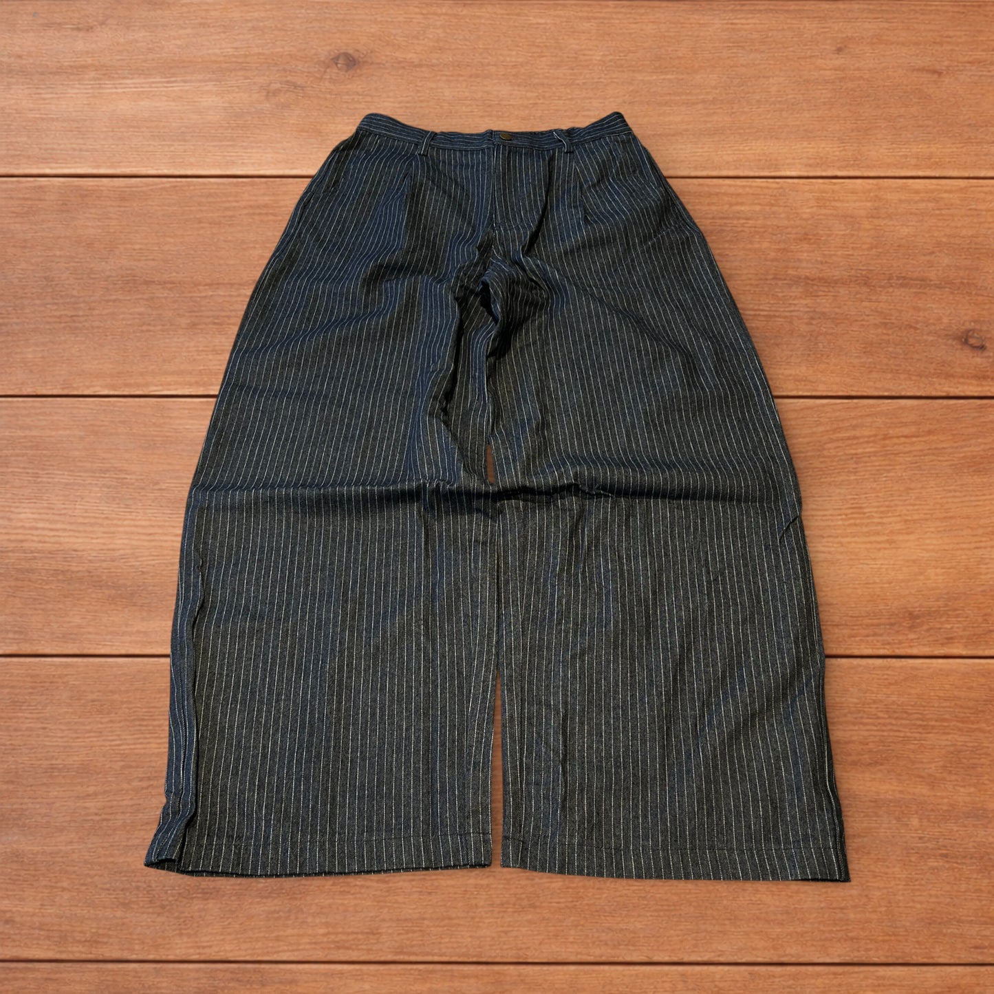 Vintage style baggy wide leg pleated twill pinstripe trousers in navy blue.