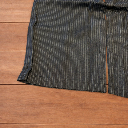 Vintage style baggy wide leg pleated twill pinstripe trousers in navy blue.