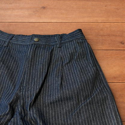 Vintage style baggy wide leg pleated twill pinstripe trousers in navy blue.