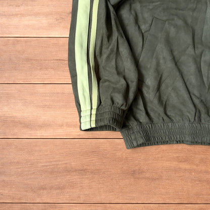 Japanese style zip up track jacket in khaki green with pale green stripes on sleeves and knotted loop front fastenings.