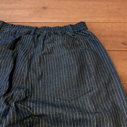 Vintage style baggy wide leg pleated twill pinstripe trousers in navy blue.