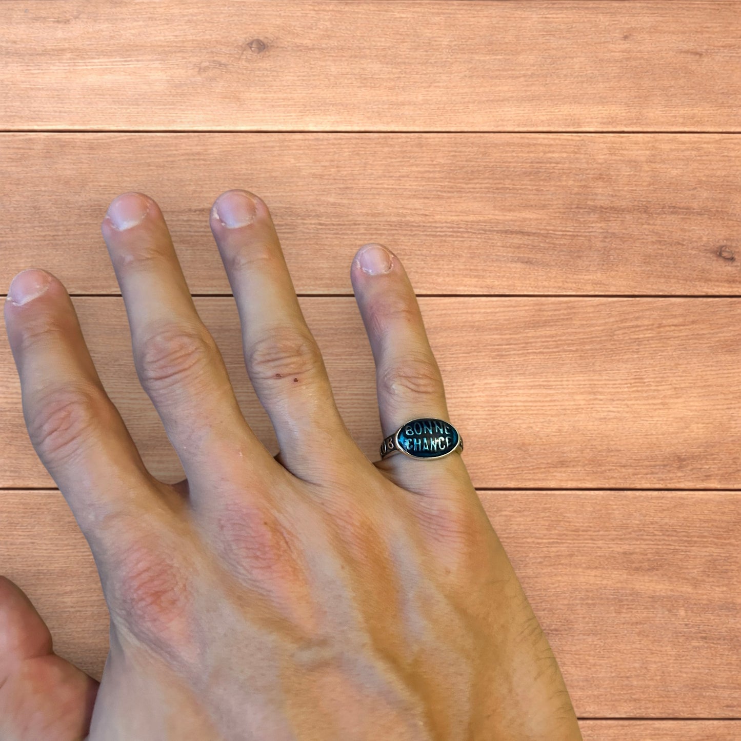 Vintage style stainless steel Bonne Chance ring in silver/ blue.