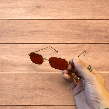 Lovely metal frame polarised sunglasses in gold with red lense.