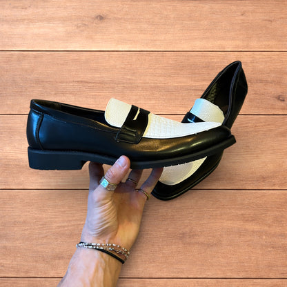 Lovely classic style loafers shoes in black and white design.