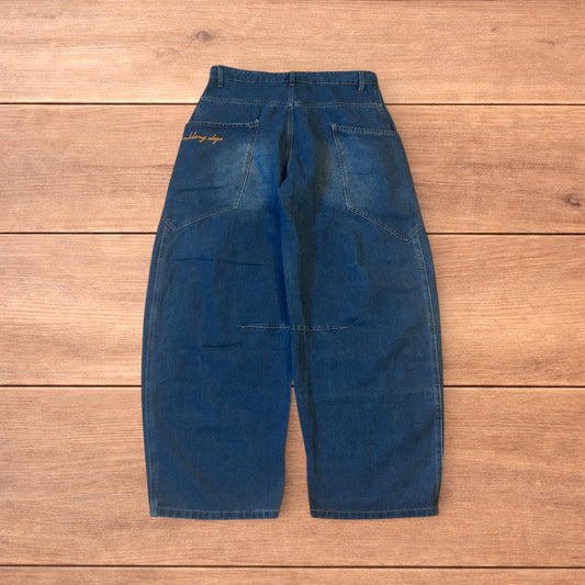 Incredible vintage style baggy wide leg skater fit jeans in mid blue.