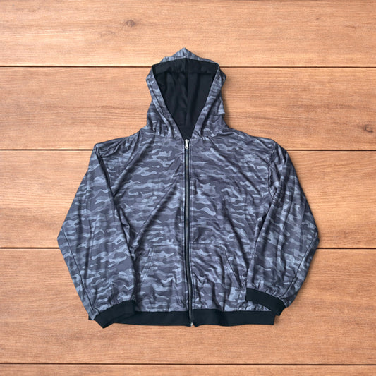 Oversized baggy reversible zip up hoodie jumper laid flat showing grey camo print and black hood lining