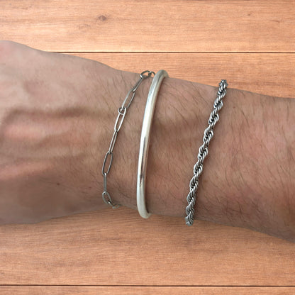 Trio of stainless steel bracelets in silver.