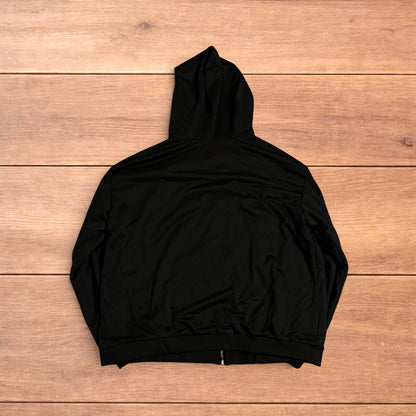 Oversized baggy reversible zip up hoodie jumper laid flat showing grey camo print and black hood lining