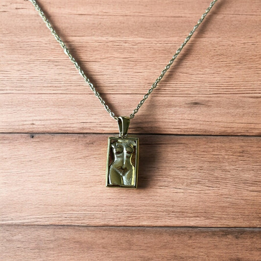 Lovely Gold stainless steel necklace of female woman figure silhouette body.