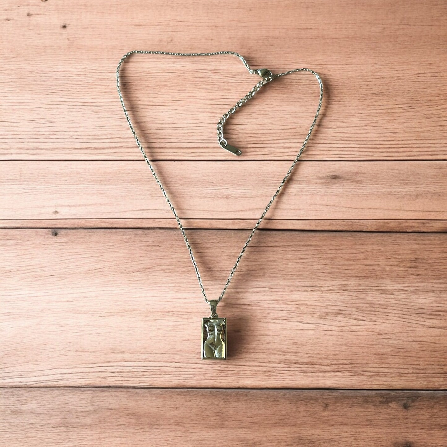 Lovely Gold stainless steel necklace of female woman figure silhouette body.