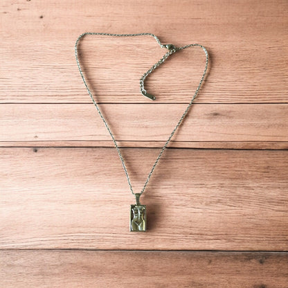 Lovely Gold stainless steel necklace of female woman figure silhouette body.