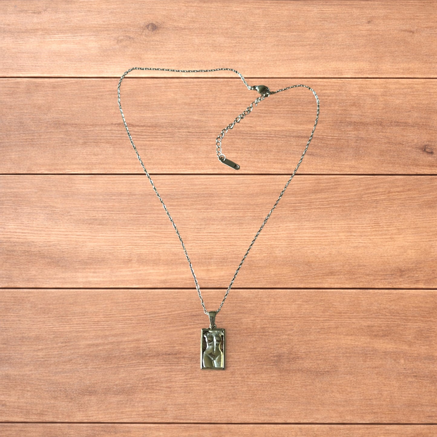 Lovely Gold stainless steel necklace of female woman figure silhouette body.