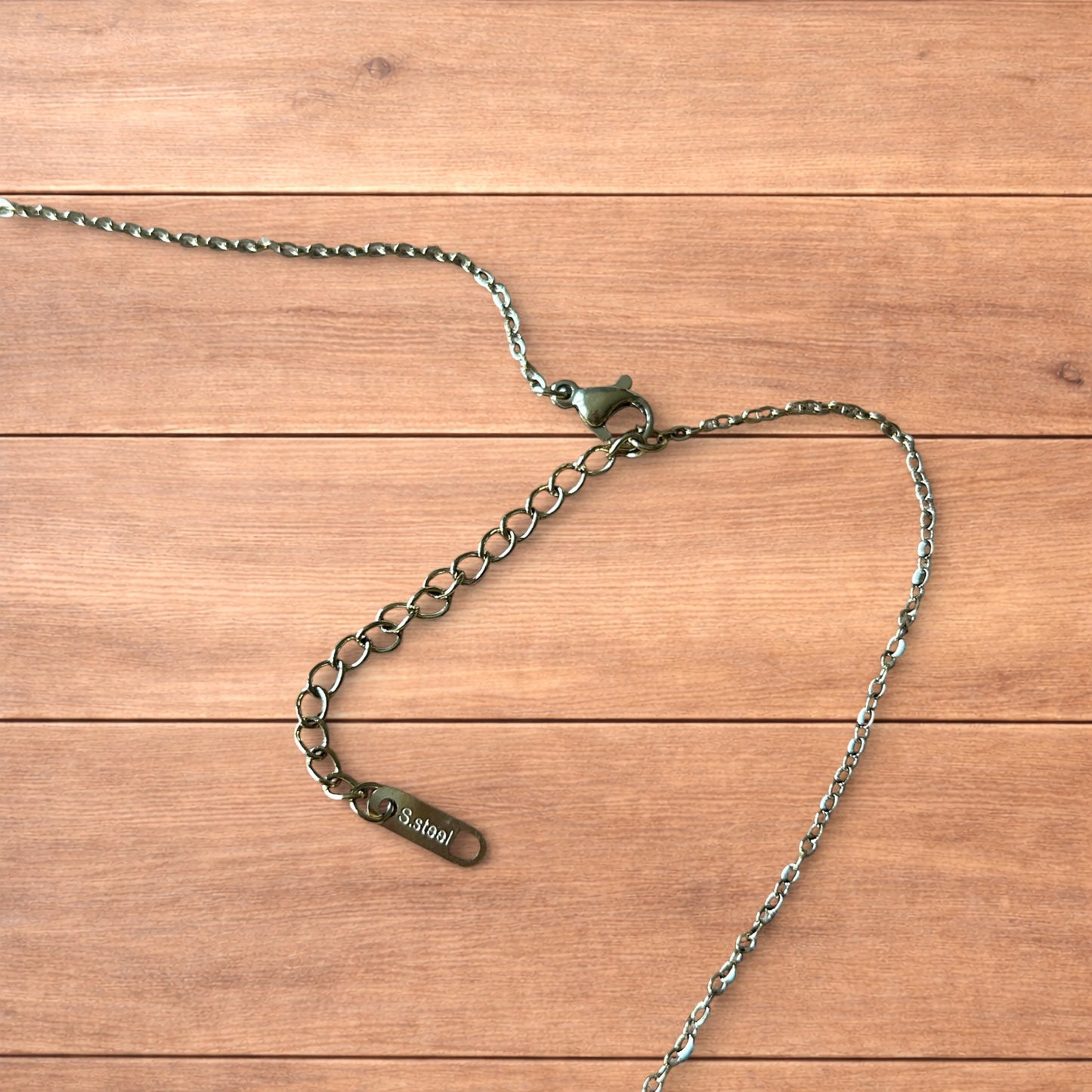 Lovely Gold stainless steel necklace of female woman figure silhouette body.