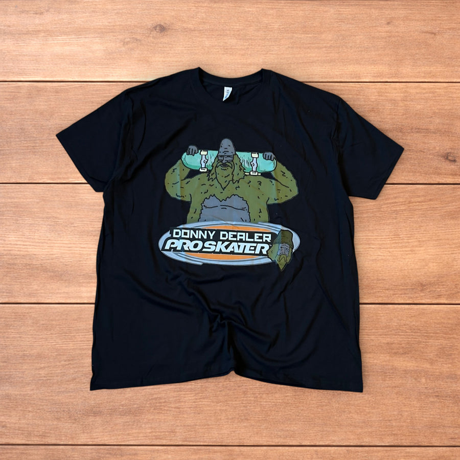 Black Big Lez Show Donny Dealer skater tshirt featuring cartoon character holding skateboard graphic on front